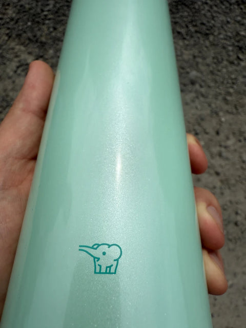 Close-up of Zojirushi logo on SM-SR60 Mint stainless steel insulated travel mug, BPA-free design.