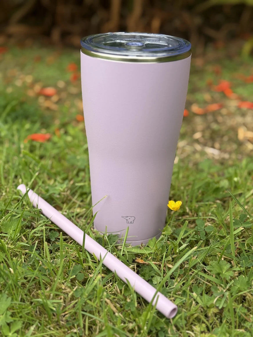 Zojirushi SX-HA Pink Straw Tumbler with reusable straw, stainless steel insulated cup 720 ml (24.35 oz) and 890 ml (30.10 oz), BPA-free cold drink tumbler on grass background