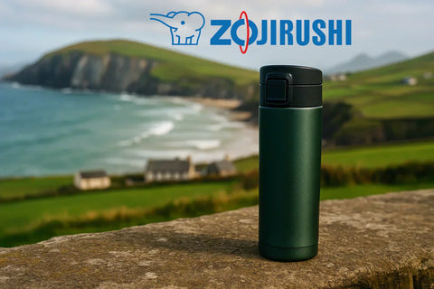 zojirushi travel mug near the beach