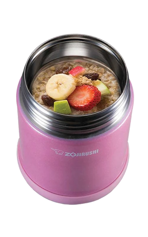 Pink  zojirushi food jar  with oatmeal and fruit on a white background