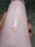 Close-up of Zojirushi logo on a pink stainless steel insulated travel mug, BPA-free design.